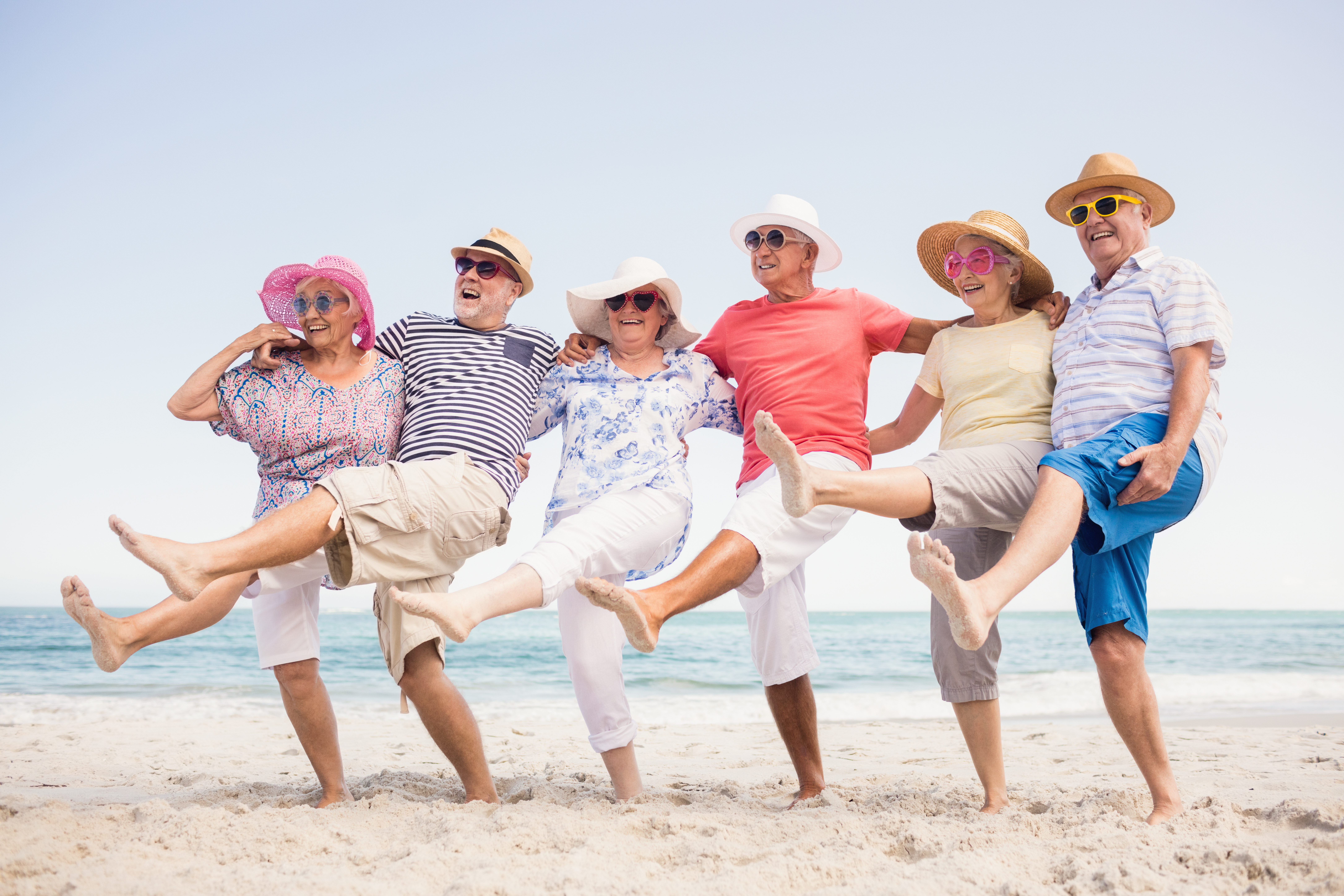 Seniors dancing on the beach